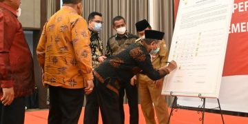 Hadiri Rakor  Bersama KPK, Bupati Merangin Tandatangani Komitmen Anti Korupsi