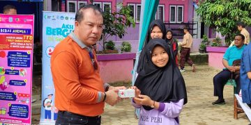 Cegah Stunting, Pj Bupati H Mukti  didampingi Kadis Dikbud Merangin Hadiri Aksi Gizi di Sekolah