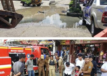 Cari Saluran Sumbatan Air Yang Rendam Jalan Tiga Jalur di Depan Pertokoan Merangin, Alat Berat diturunkan