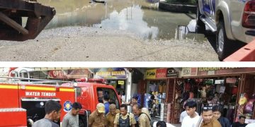 Cari Saluran Sumbatan Air Yang Rendam Jalan Tiga Jalur di Depan Pertokoan Merangin, Alat Berat diturunkan